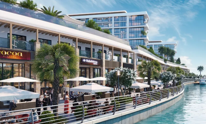 Shops and cafe terraces along the marina promenade below Pierside Marina Residences