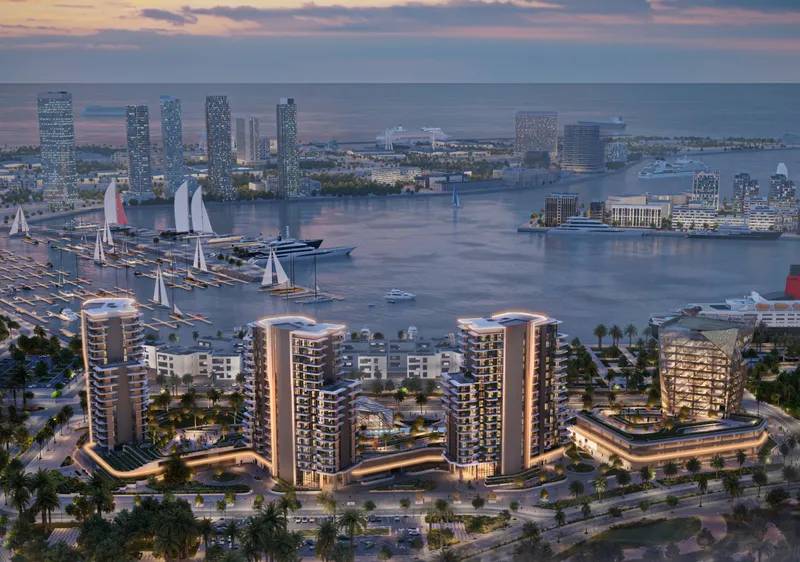 Aerial render of the three Portside Square towers and business tower at Mina Rashid, with the marina behind