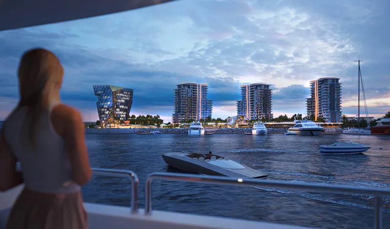 Render of Portside Square seen across the water from a yacht at Mina Rashid