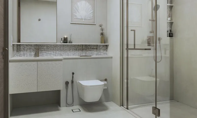 Bathroom with a vanity, wall-hung toilet and glass shower at Pristine Beach Residences
