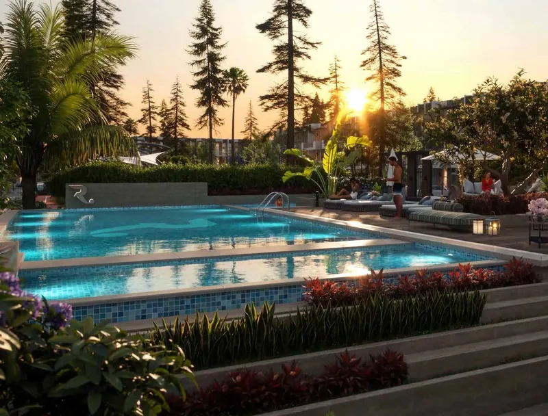 Community swimming pool at R. Hills surrounded by planting at sunset (developer render)