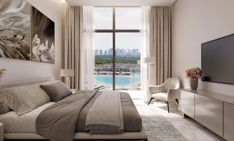 Bedroom of a Riverside Crescent apartment with a full-height window facing the lagoon