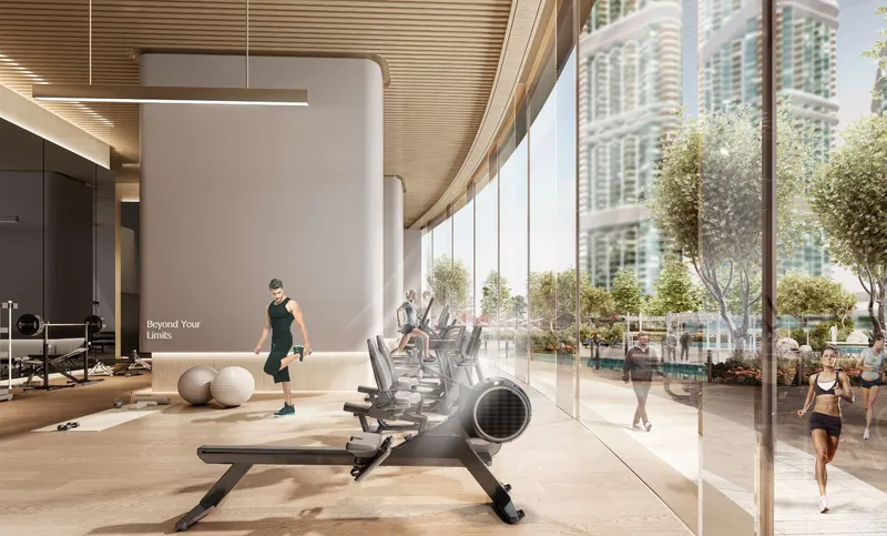 Indoor gym at Riverside Crescent with full-height glazing facing the gardens