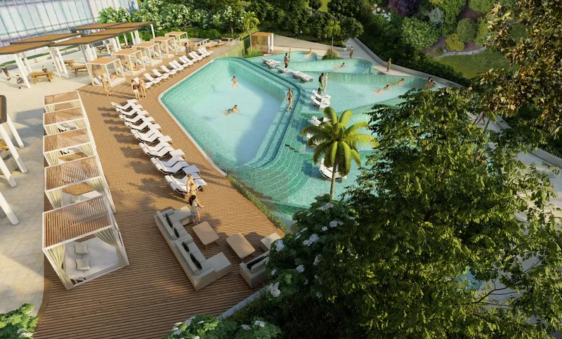 Leisure pool with cabanas and sun loungers on a timber deck at Riverside Crescent, seen from above