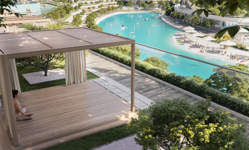 Shaded garden pavilion at Riverside Crescent overlooking the lagoon and its beach
