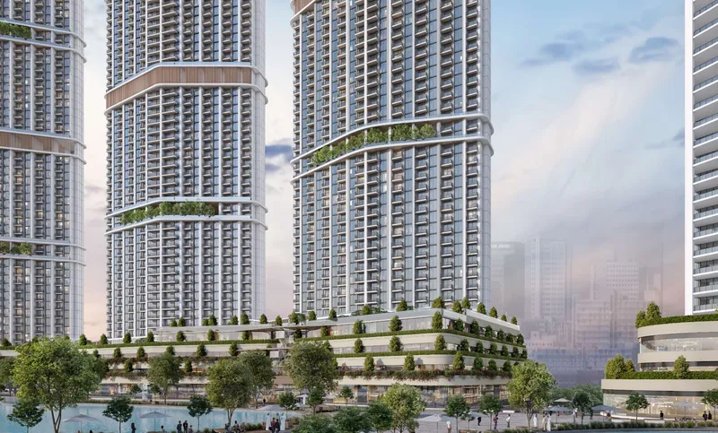 Riverside Crescent towers rising above the planted podium terraces at Sobha Hartland II