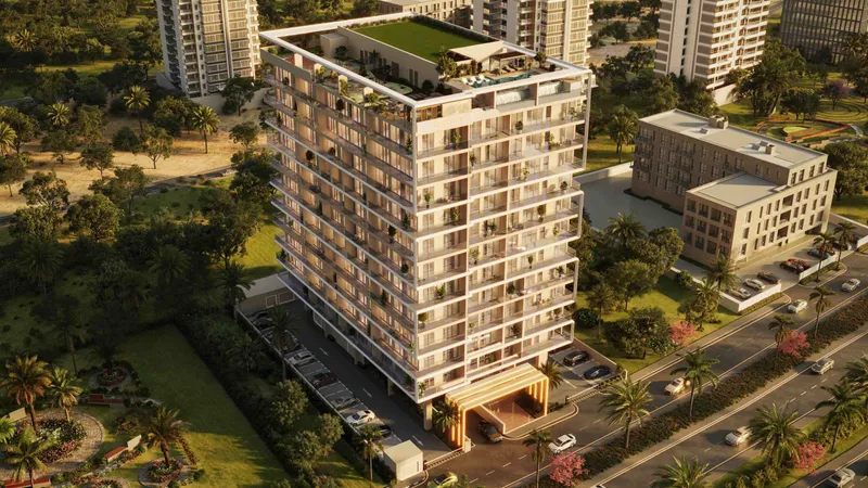 Aerial render of RIVO by Grovy in Dubailand Residence Complex, a cream-coloured apartment building with a planted roof beside a landscaped road