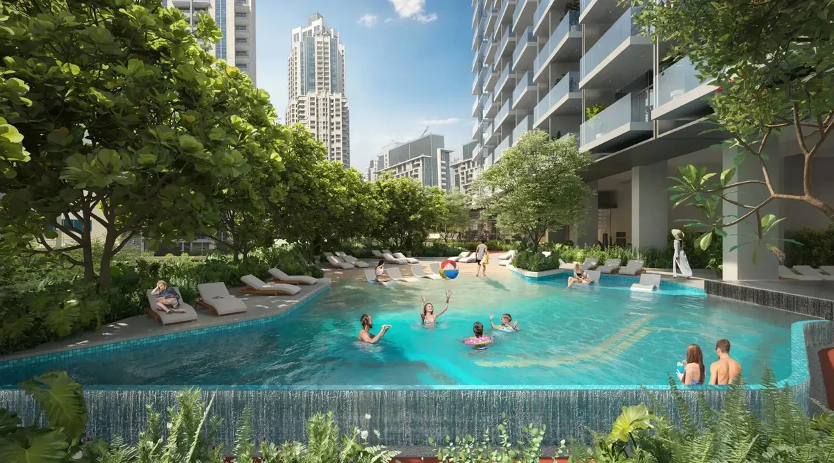 Residents in the beach-entry pool on the landscaped podium at Rove Home Downtown Dubai