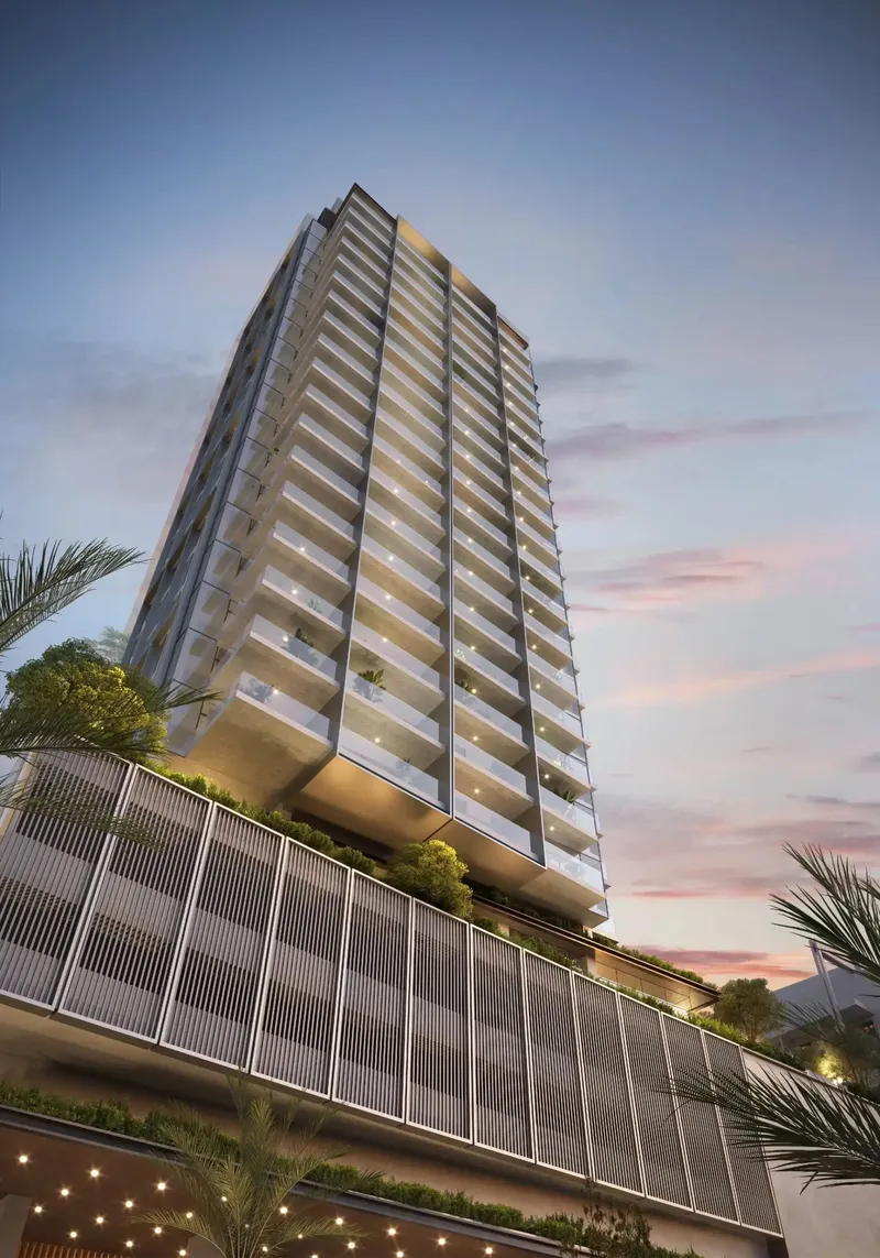 Render of the Rove Home Downtown Dubai tower rising above its louvred podium against an evening sky
