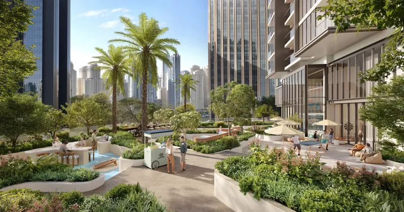 Landscaped podium garden with palms, seating and pathways at Rove Home Dubai Marina