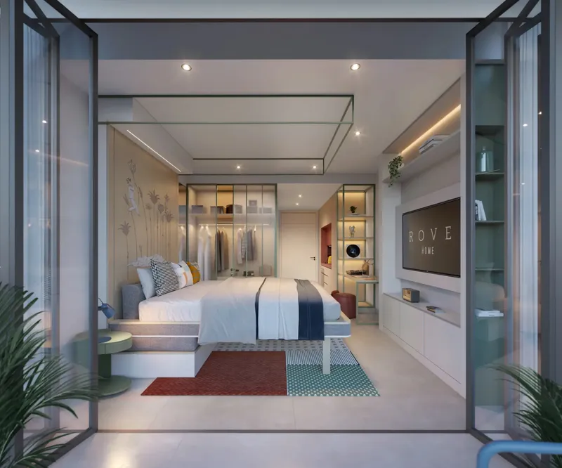 Furnished Studio Flex apartment seen through open bi-fold glass doors, with the bed lowered