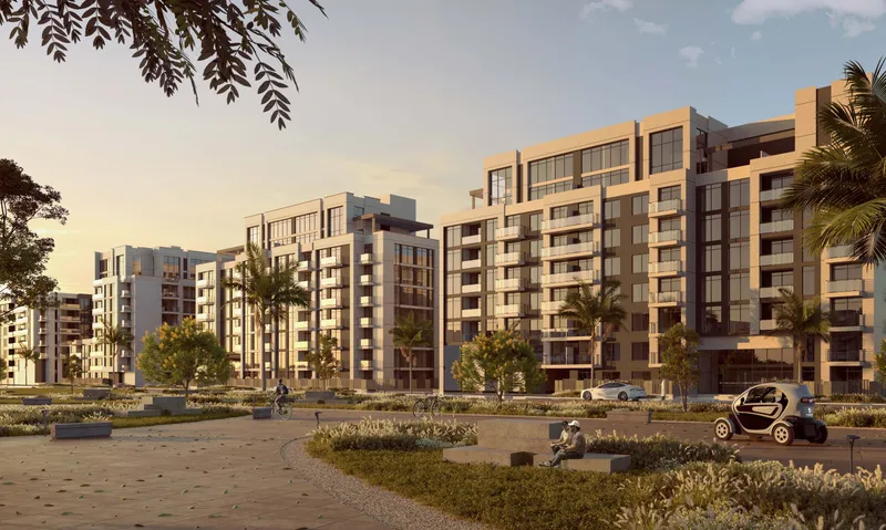 Royal Park buildings across an open landscaped plaza at sunset (developer render)