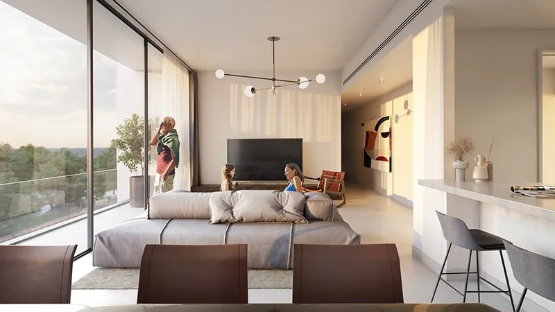Render of a Safa apartment living room with a sofa, wall-mounted television, kitchen counter and a glass door to the balcony