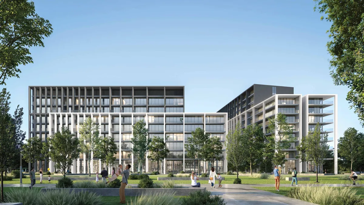 Render of the Safa apartment buildings at Aljada seen across a lawn, with light and dark grid facades and people on the paths
