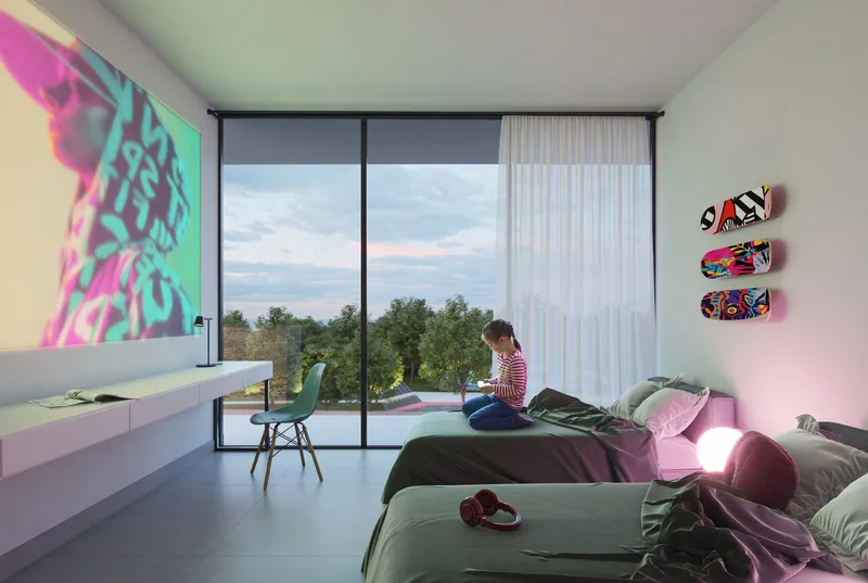 Render of a Safa Parkview children's bedroom with two beds, a long desk and a full-height window looking over the park