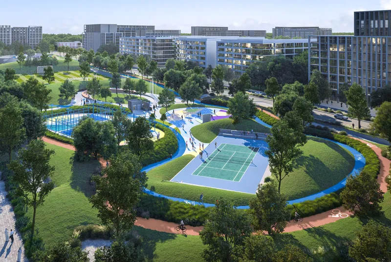 Aerial render of the Aljada sports complex with courts, pitches, a jogging track and lawns, and apartment buildings around it