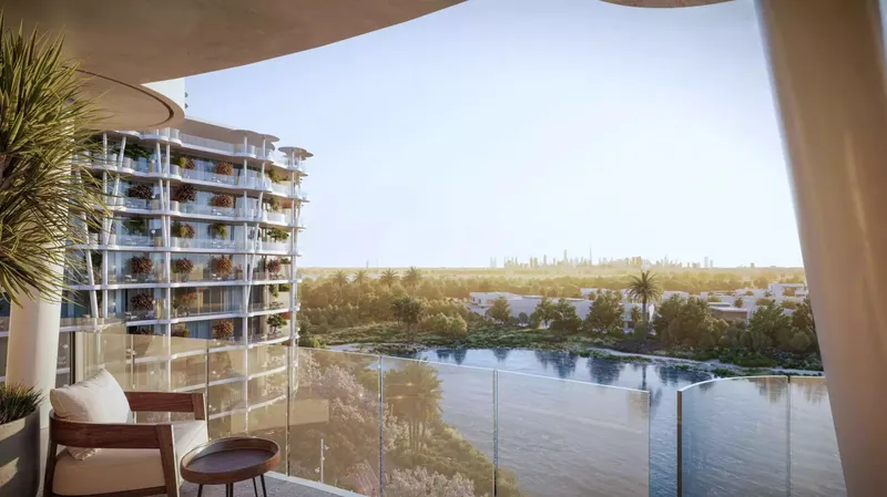 View from a curved balcony at Sakura Gardens over the lagoon and trees