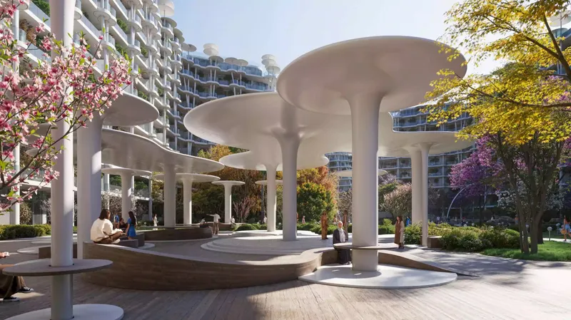 Round white shade pavilions over seating in the central gardens of Sakura Gardens