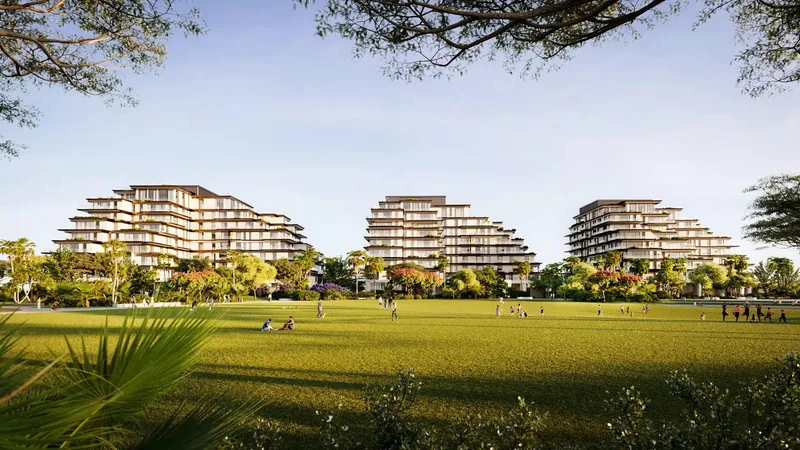 Render of the three low-rise Sama Yas buildings seen across the lawn of Yas Park
