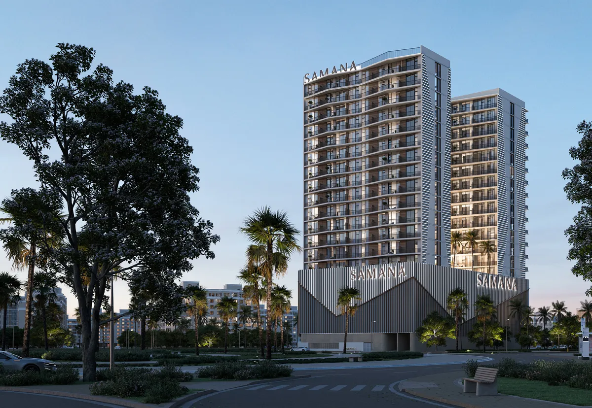 Render of the Samana Greenfield apartment towers in Al Warsan at dusk
