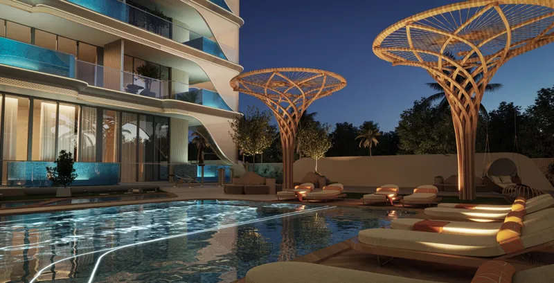 Render of the pool deck at Samana Imperial Garden lit at night with sun loungers