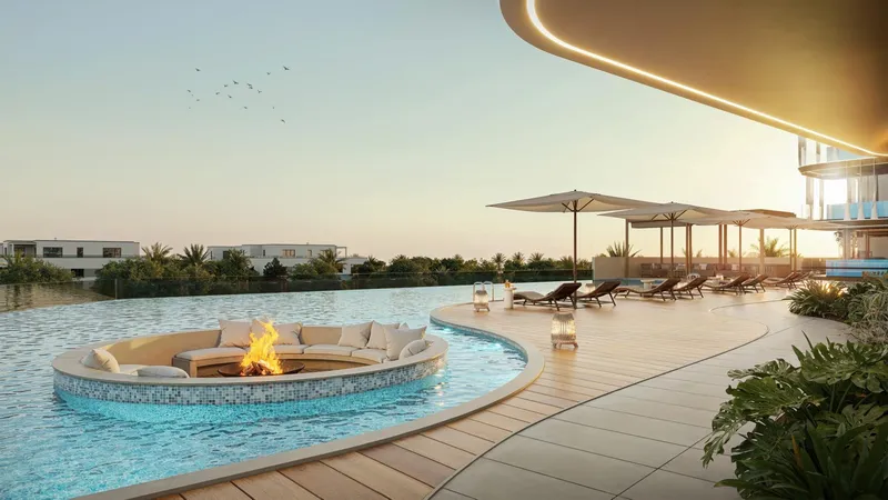Render of a sunken fire-pit seat in the pool at Samana Ocean Bay at sunset