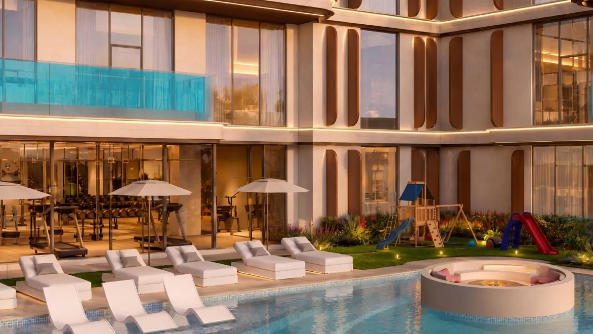 Render of the pool deck at Samana Portside with sun loungers, the gym and the kids' play area