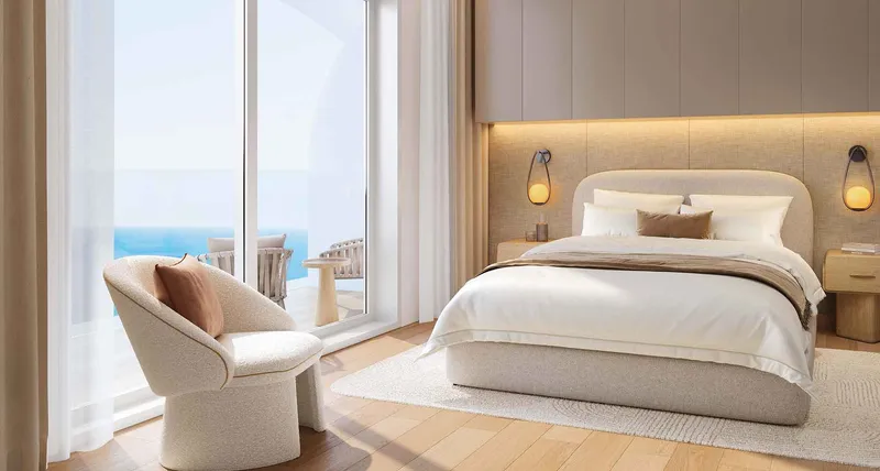 Render of a Seef Residences bedroom opening on to a sea view balcony