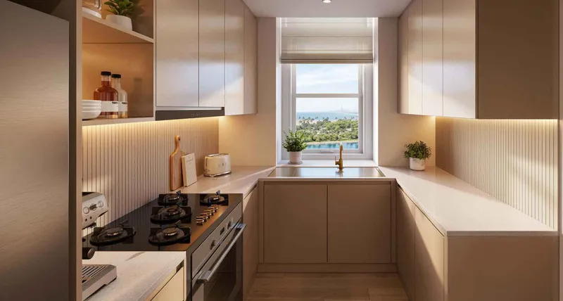 Render of a Seef Residences kitchen with a window over the lagoon