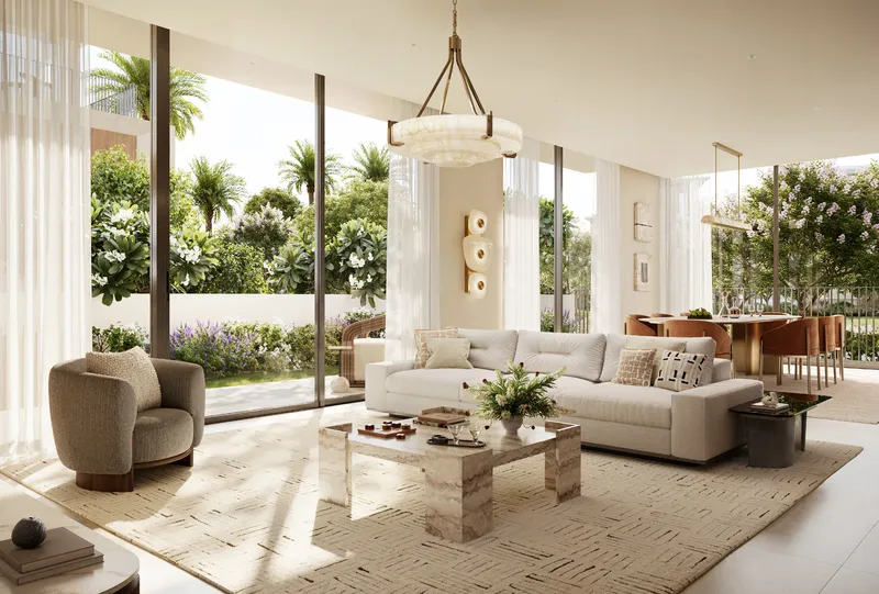 Living room in a Selvara 3 villa with full-height glazing onto the garden