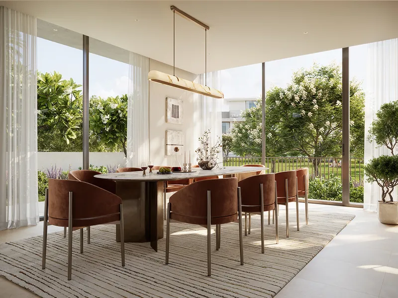 Dining room in a Selvara 4 villa with full-height glazing and garden views