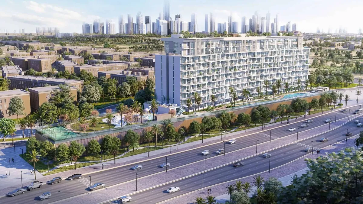 Aerial view of Serene Gardens II, a ten-storey apartment building above a landscaped podium beside a main road
