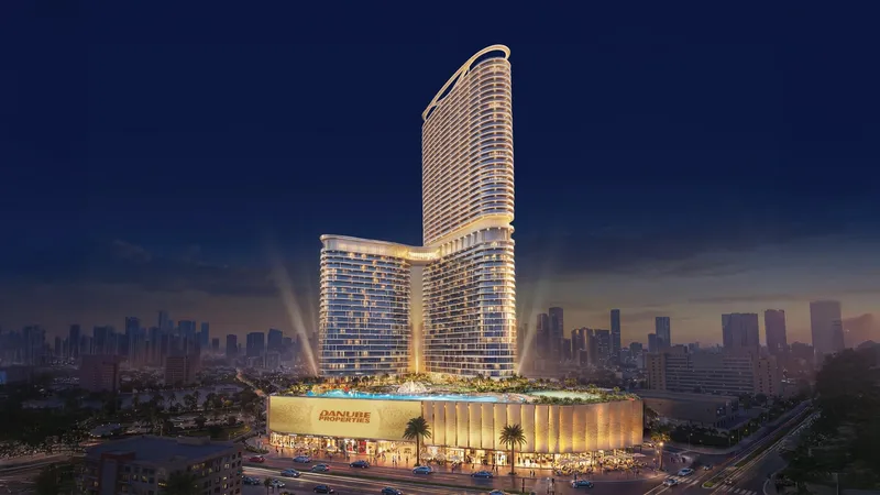 Serenz by Danube tower at night with the podium pool deck lit