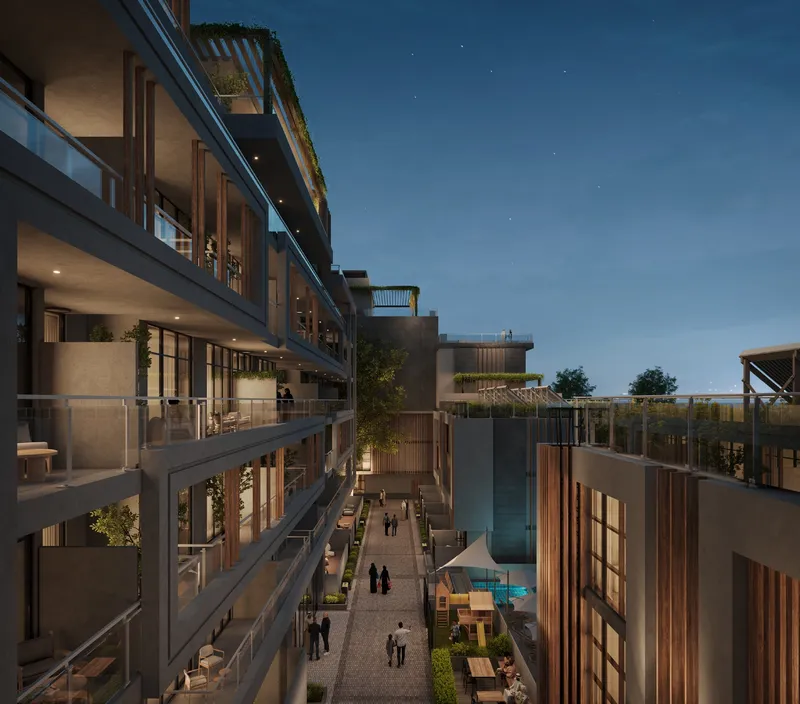 Sila's inner courtyard walkway at night between terraced balconies (developer render)