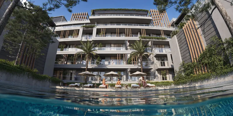 Swimming pool in the Sila courtyard with sun loungers and palm trees (developer render)