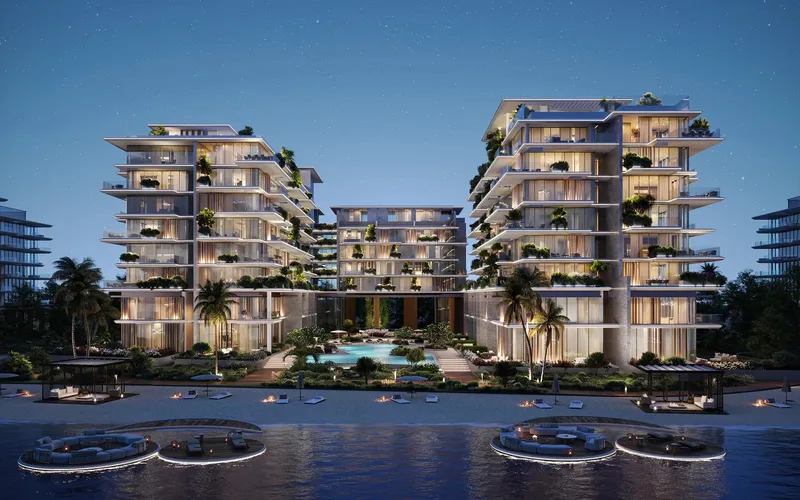 Render of Silena's three linked buildings on the Dubai Islands beachfront at dusk, with the central pool between them