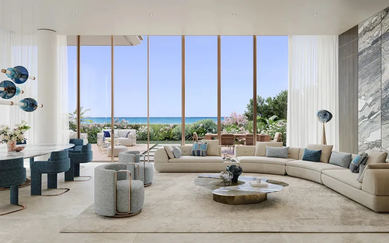 Render of a townhouse living room at Silena opening onto a garden terrace with sea views