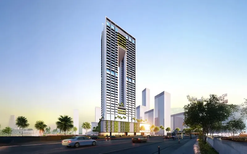 Render of Sky Gate Tower seen from the street at dusk in Jumeirah Village Triangle