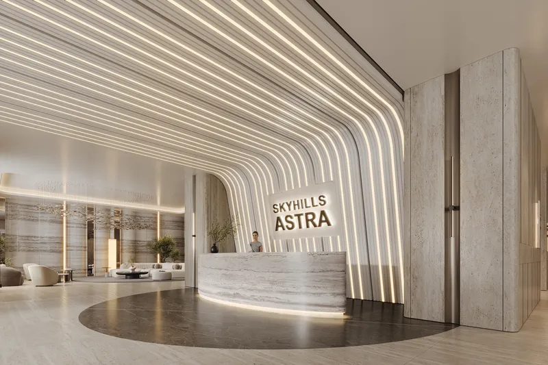 Entrance lobby with a stone reception desk and ribbed illuminated ceiling at Skyhills Astra