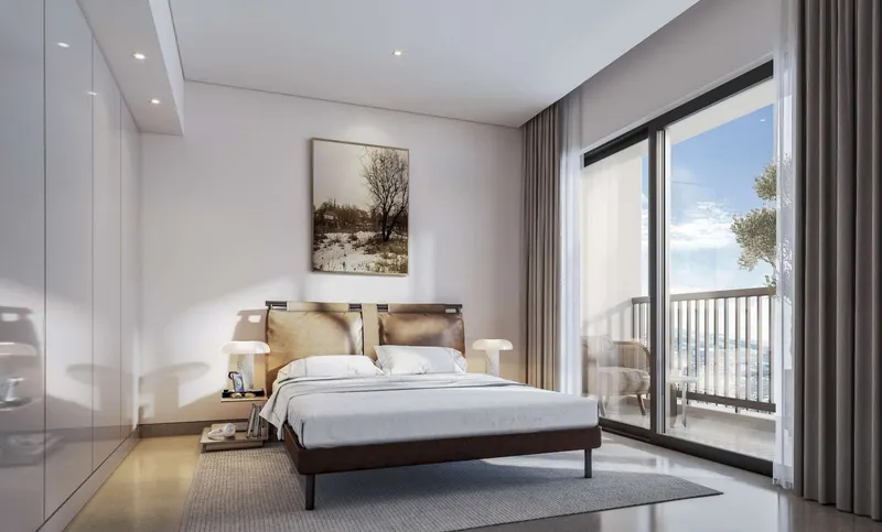 Sobha Orbis bedroom with fitted wardrobes and a sliding door to the balcony