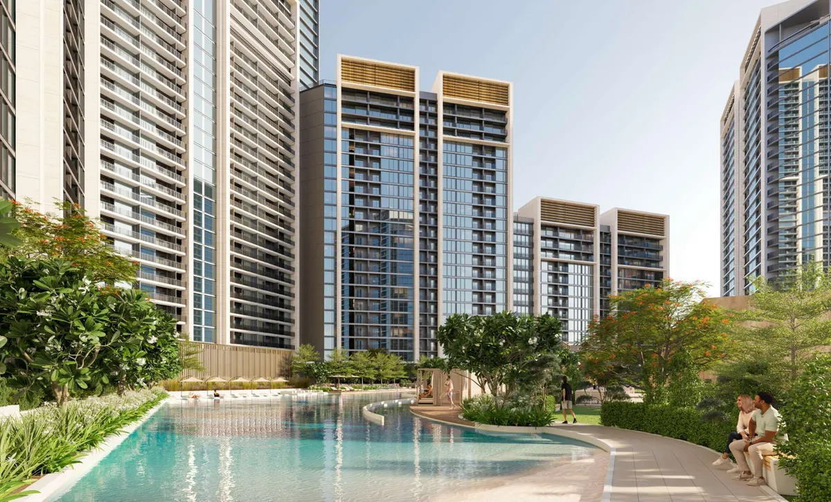 Resort-style pool and garden walkway between the Sobha Orbis towers
