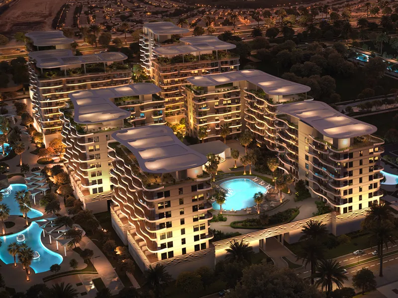 Aerial night render of the Sorrento buildings with curved roof canopies around lit pools
