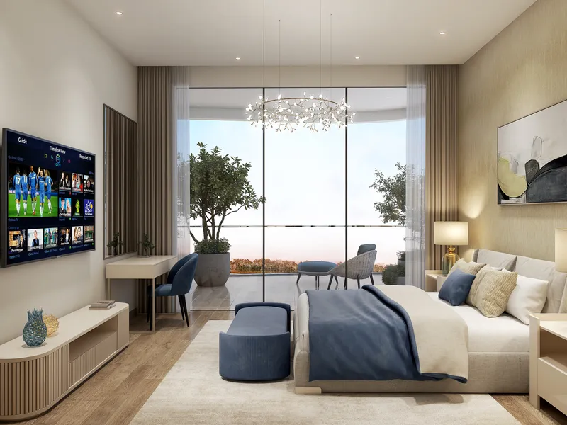 Bedroom in a Sorrento apartment with a desk and full-height glazing to a balcony