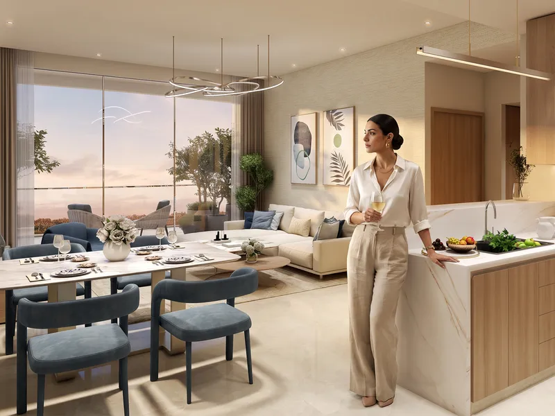 Open-plan kitchen, dining and living area in a Sorrento apartment with a marble island