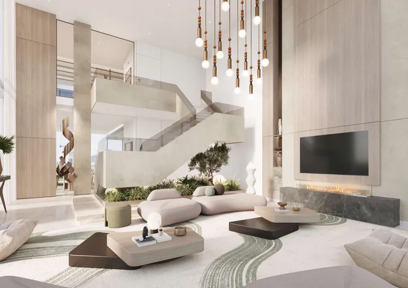 Render of a double-height lounge with a staircase at Soto Grande