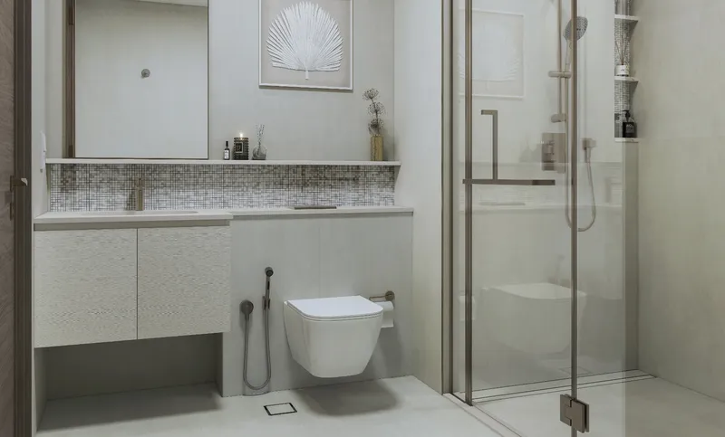 Bathroom at Starline Beach Residences with a glass shower enclosure and vanity