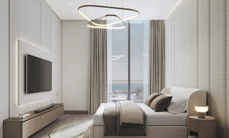 Bedroom at Starline Beach Residences with a full-height window and sea view