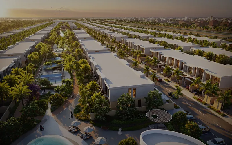 Aerial render of Sukoon by Sanzen at sunset, with rows of villas, palm-lined streets and a pool