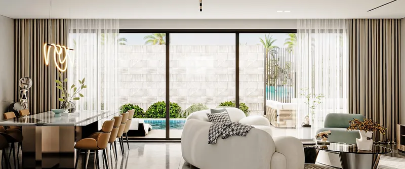 Render of a Sukoon villa living and dining room opening onto a private garden