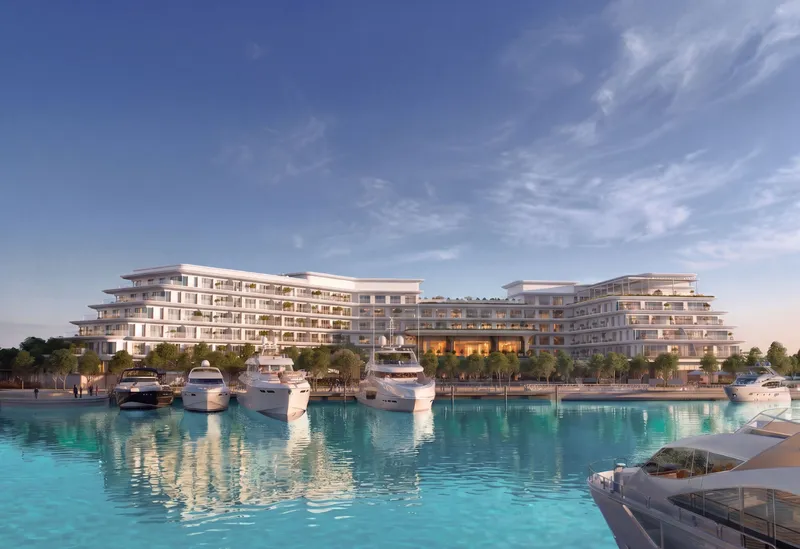 Render of The Bristol Hotel & Residences seen from the water, with yachts moored in front